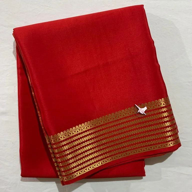 Glossy Finish Red Soft Silk Saree With Trendy Blouse Fabric And Zari Border