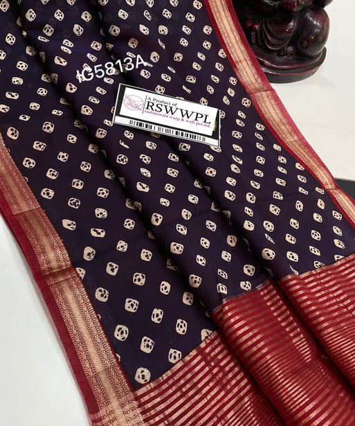 "Blue and white Bagh print Banarasi saree with intricate zari border, epitome of elegance and tradition."