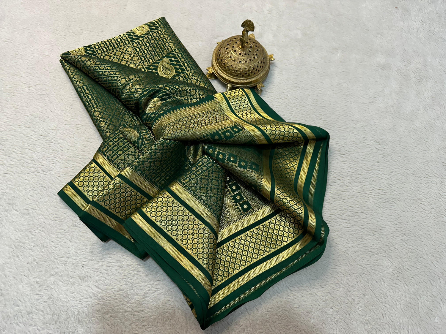 Traditional Dark Green Banarasi Brocade Saree With Gold Zari Weaving For Festive Wear